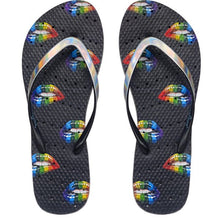 Load image into Gallery viewer, Image of shower flip flops with rainbow colored lips on a black sole. Made by Showaflops