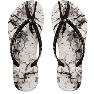image of shower flip flops with an abstract print. Showaflops